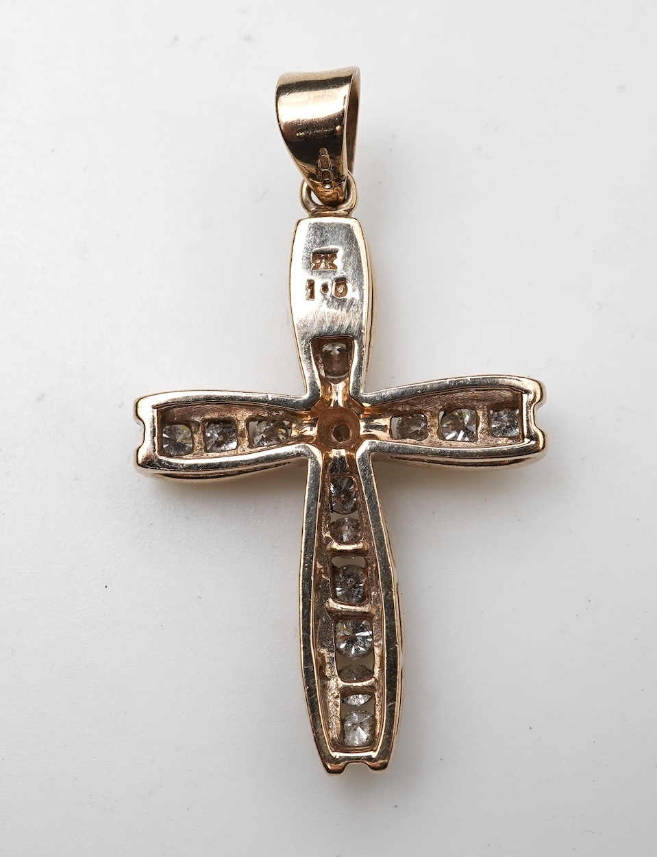 A diamond cross pendant
